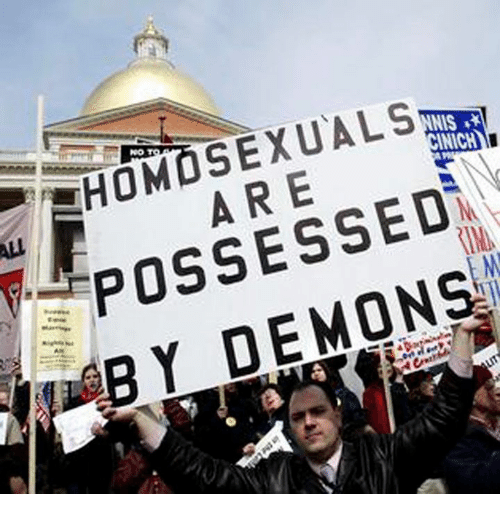 Man with sign "Homosexuals are possessed by demons"