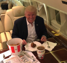 Donald Trump is enjoying a KFC meal on his plane ride abroad Air Force One. 