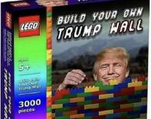 A digital mock-up of a fictional LEGO box set titled "BUILD YOUR OWN TRUMP WALL" for ages 5 and up. The box features the official red LEGO logo and shows a edited image of Donald Trump smiling as he stacks colorful toy bricks to build a wall against a mountain background.